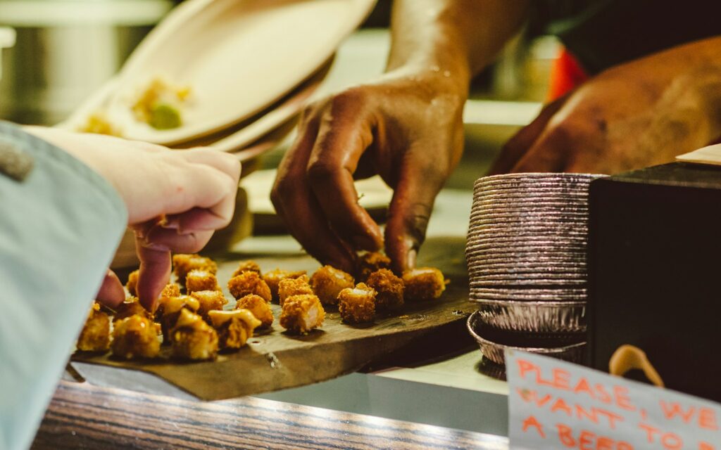 two persons holding food